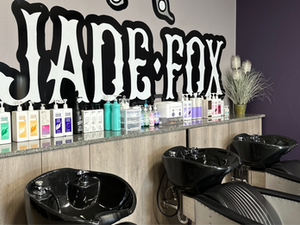 View of the shampoo area and backbar at Jade Fox.
