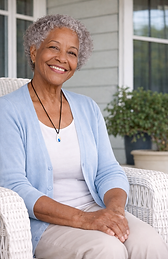 Customer wearing a PAL BUTTON® Home System medical alert button as a pendant