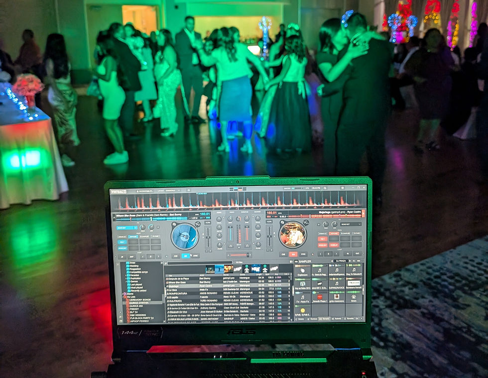 Eye-level view of DJ booth with colorful lights at a party