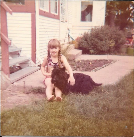 Girl with Scottish Terrier dog