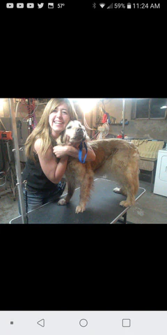 KJE hugging a very special Golden Retriever, named Cheyenne