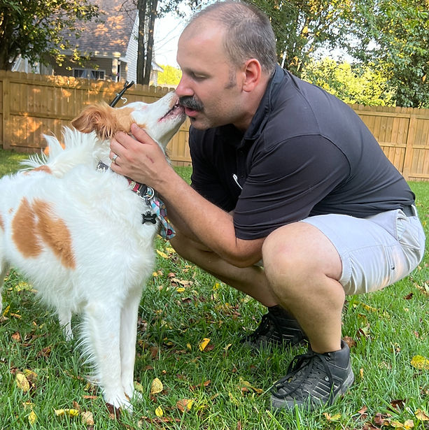 Owner of A Pet Sitting Love Hub LLC Joe Edinger with client Odin