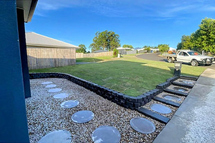 Another retainer wall and steps to reduce the fall and amount of storm water falling towards the dwelling
