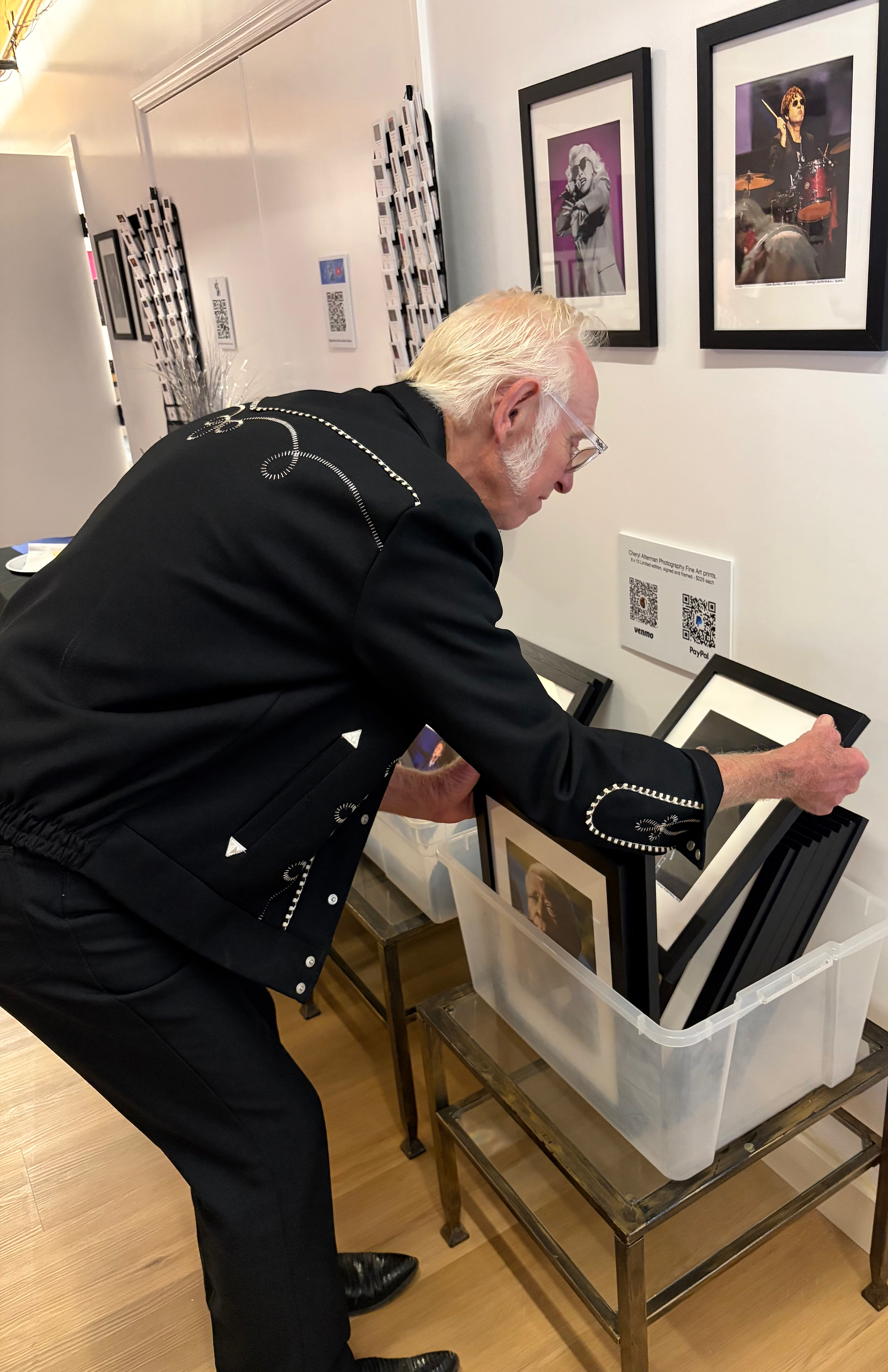 Doug Blumer flipping thru prints