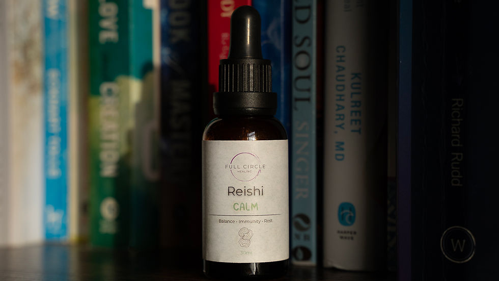 Brown bottle labeled "Reishi CALM" on a wooden shelf with books. Text includes "Balance · Immunity · Rest" and "Full Circle Healing."