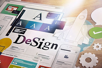 Various paper design pieces showing color and font include a flat paper rocket and paper gears. The word design is centered.