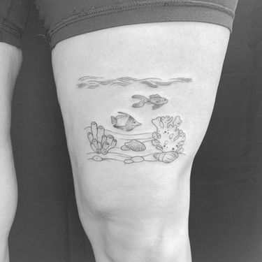 fine line under the sea tattoo on thigh