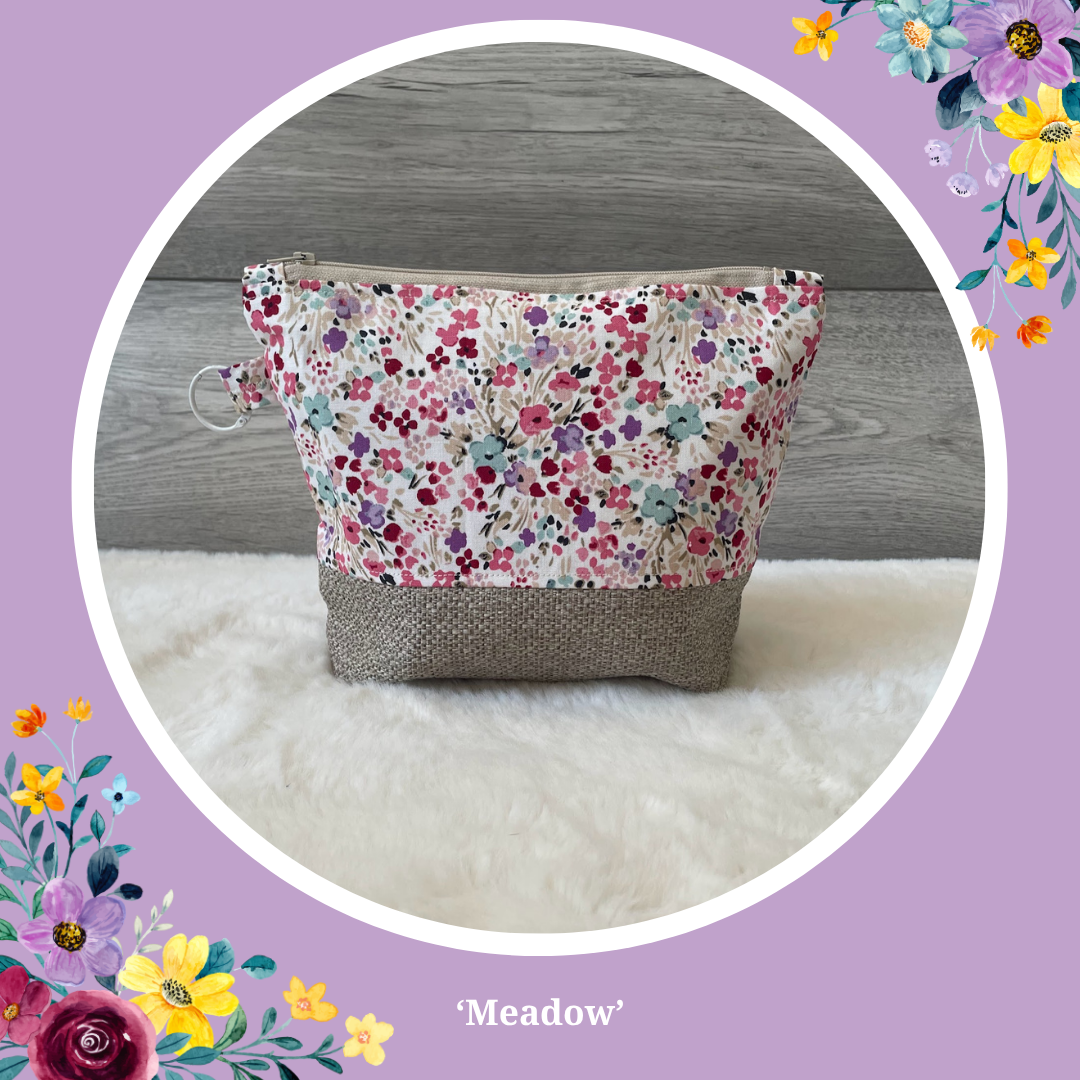 Handmade 'Meadow' makeup bag in a ditsy floral print with a linen base.