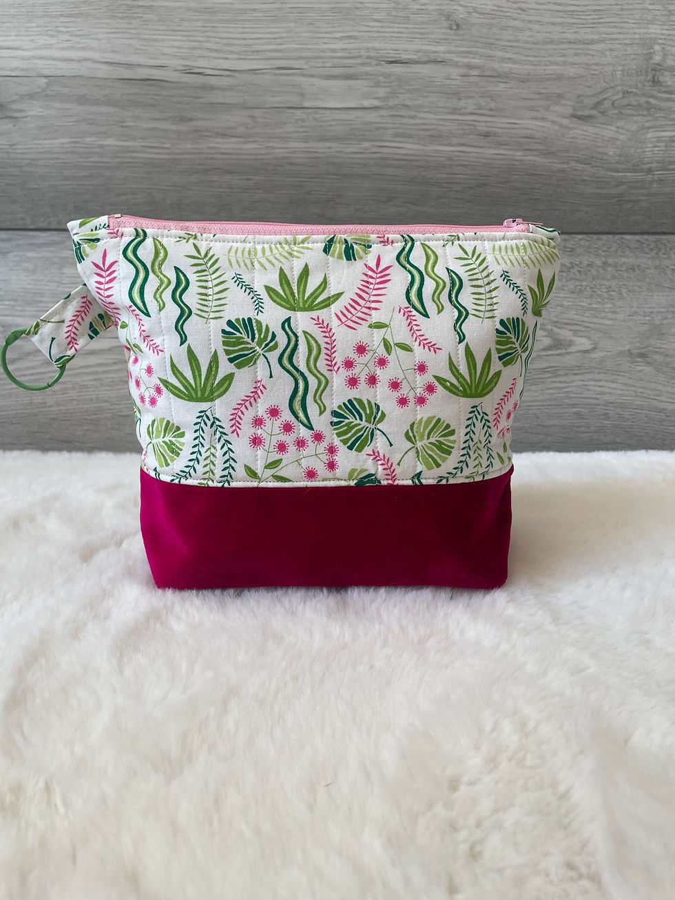 Thumbnail: Handmade tropical-print makeup bag with a burgundy suede base.