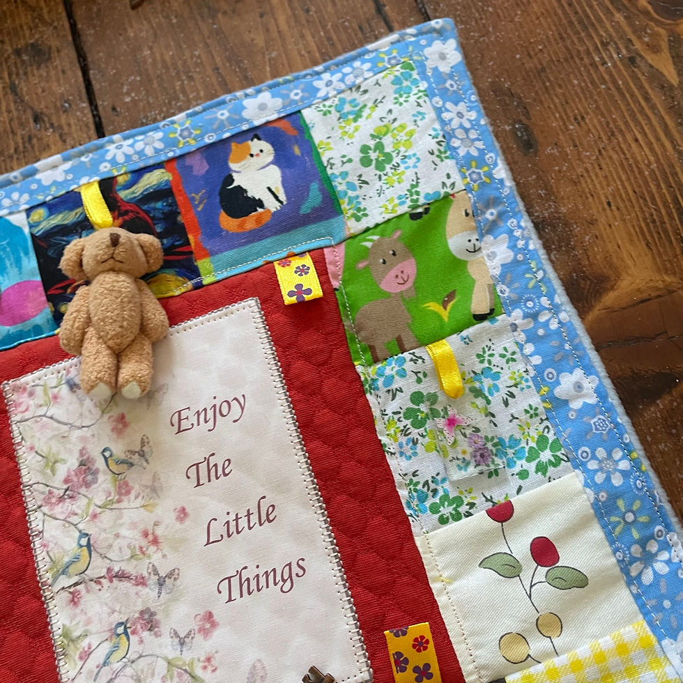Thumbnail: Fidget blanket showing embroidered panel and patchwork detail, made in Ireland by The Owl Tree