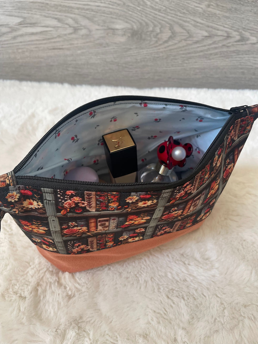 Thumbnail: Handmade makeup bag open to reveal the pretty floral lining.