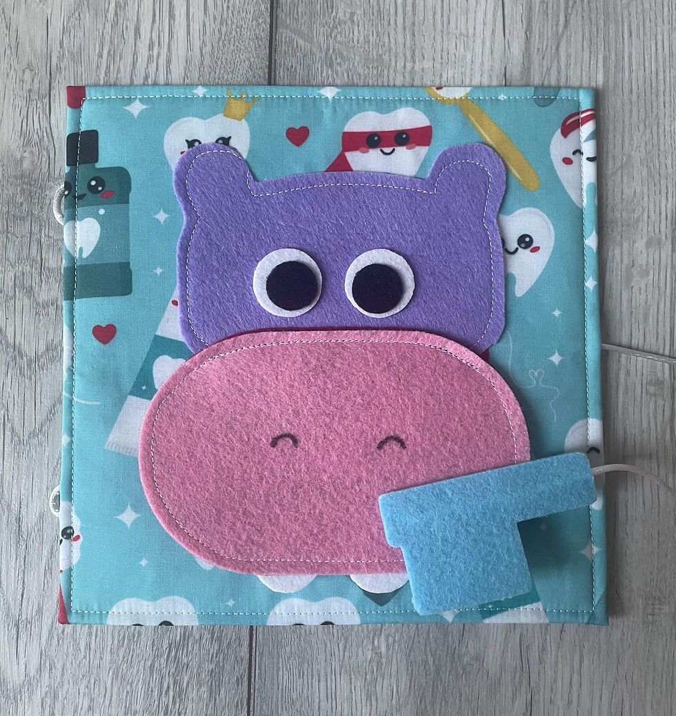 Thumbnail: front view of felt hippo and toothbrush tooth cleaning activity