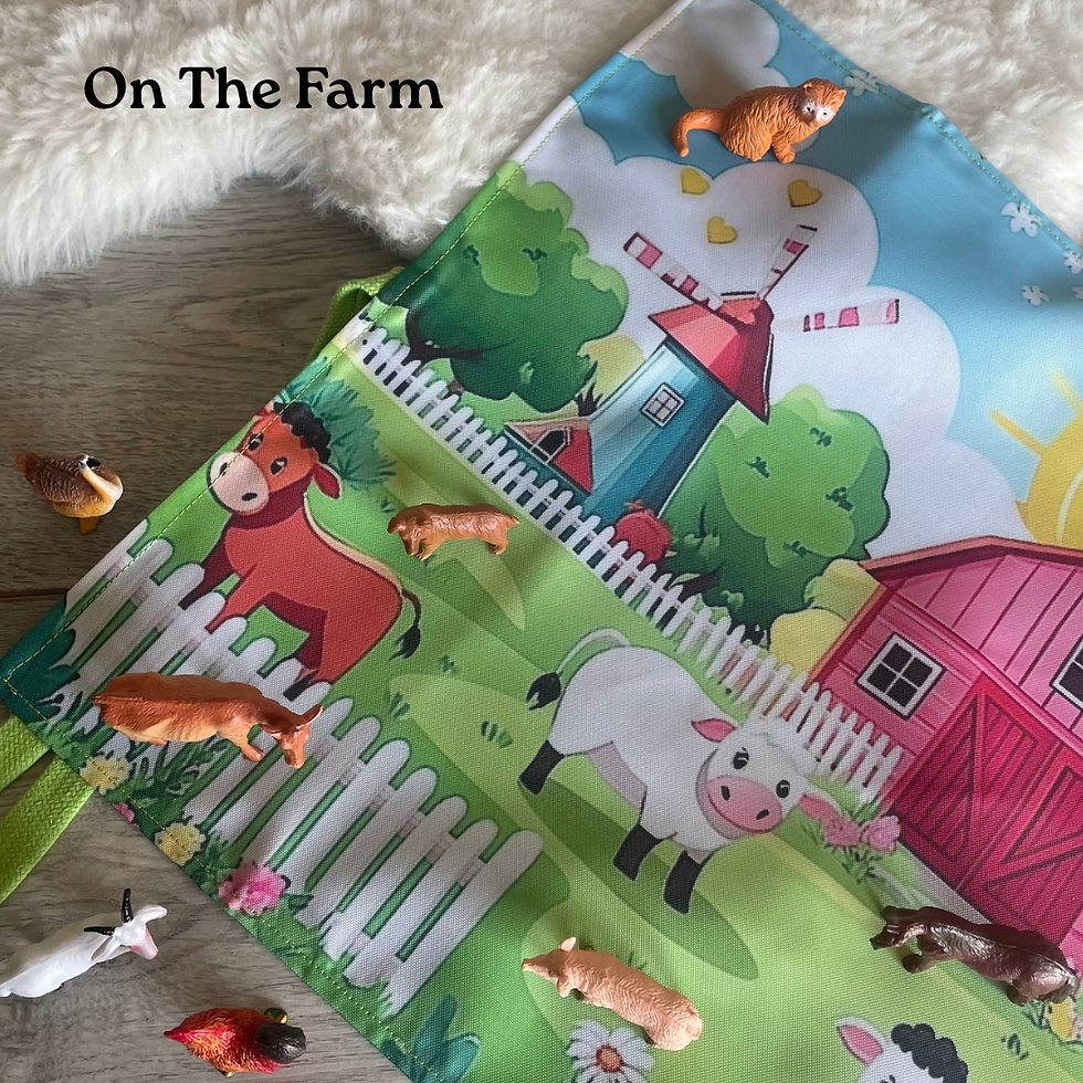 Handmade farmyard play mat laid flat with farm animal figures