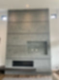 A grey Venetian Plaster fireplace