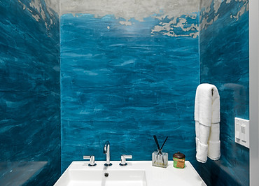 A blue and grey venetian Plaster bathroom.