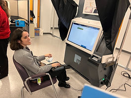 Image of SILO Board member, Krista Giannak, testing the Express Vote XL voting machine at SILO