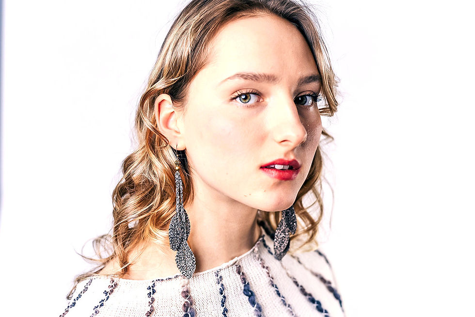 Source earrings, bronze