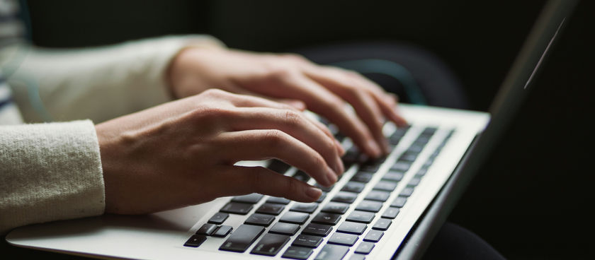 Woman typing at Laptop Keyboard. Photo by Kaitlyn Baker on Unsplash.