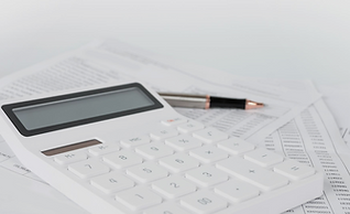Calculator and pen on paper in white background