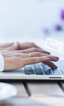 Woman typing at a keyboard with white outlined transparent cartoon envelopes rising from it.