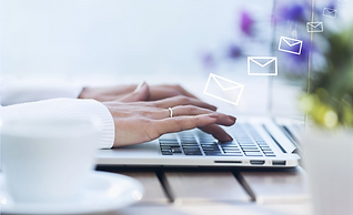 Woman typing at a keyboard with white outlined transparent cartoon envelopes rising from it.