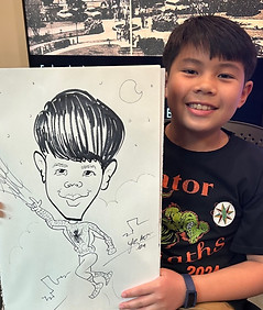 an asian boy at the exhibit unknown sitters at the historic new orleans collection holds his spiderman cartoon