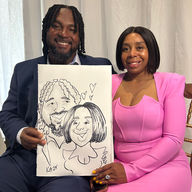 A couple holds their caricature by caricature artist near me kathy buskett at a wedding at the slavonian lodge in Biloxi MS