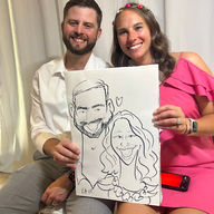 a couple gets a wedding caricature by wedding caricature artist kathy buskett in biloxi at the slavonian lodge
