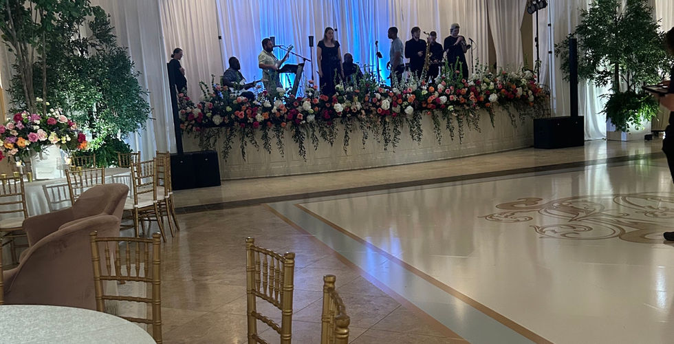 Flowers cover the stage at a beach wedding venue in biloxi
