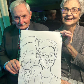 A couple gets a caricature at a wedding at the oakes venue in Ponchatoula, LA