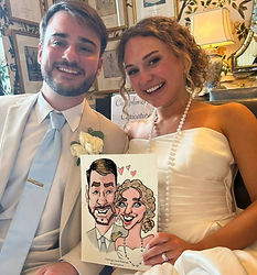 a bride and groom hold their wedding artist's digital wedding caricature 