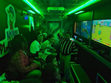 Kids having an amazing time Playing Video game , inside our mobile arcade during the game