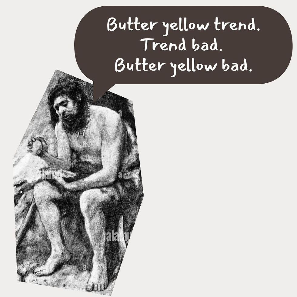 Caveman in grayscale, sitting and speaking in a speech bubble: "Butter yellow trend. Trend bad. Butter yellow bad." The mood is skeptical.