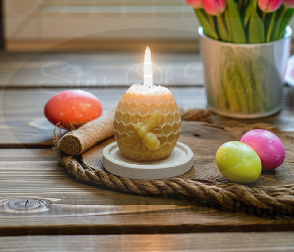 Thumbnail: Handmade beeswax egg candle with hexagonal and bee details burning