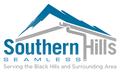 Outline of roofline with mountains in background.