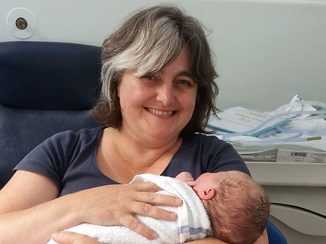Cathy, Chilled Mama, holding the newborn