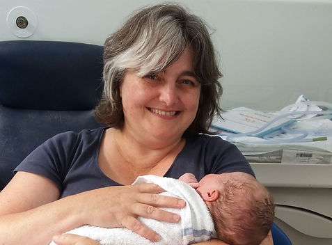 Cathy, Chilled Mama, holding the newborn
