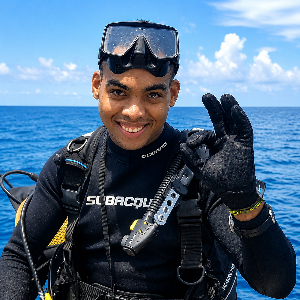 Smiling scuba diver gives OK sign Manuel.D