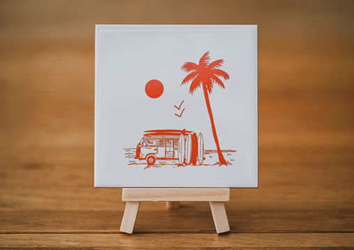 Small display tiles with surf art and Beer Village printed on them.