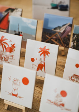 Small display tiles with surf art and Beer Village printed on them.