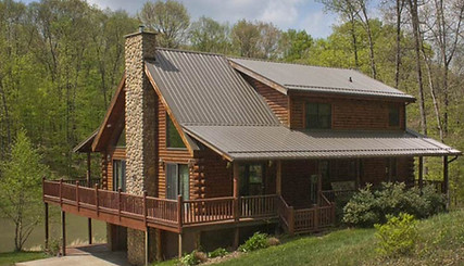 New metal roof on a log cabin style home.