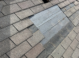 Wooster Ohio home with shingles missing from a roof