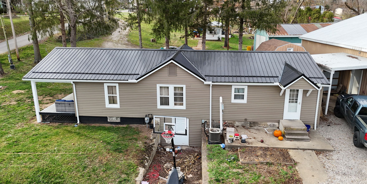 Roseville, Ohio home featuring a Premier Rib metal roof and Canyon ProVia Cedar Peaks Dutch Lap siding installed by a local roofing contractor.
