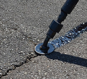 Crack sealing process