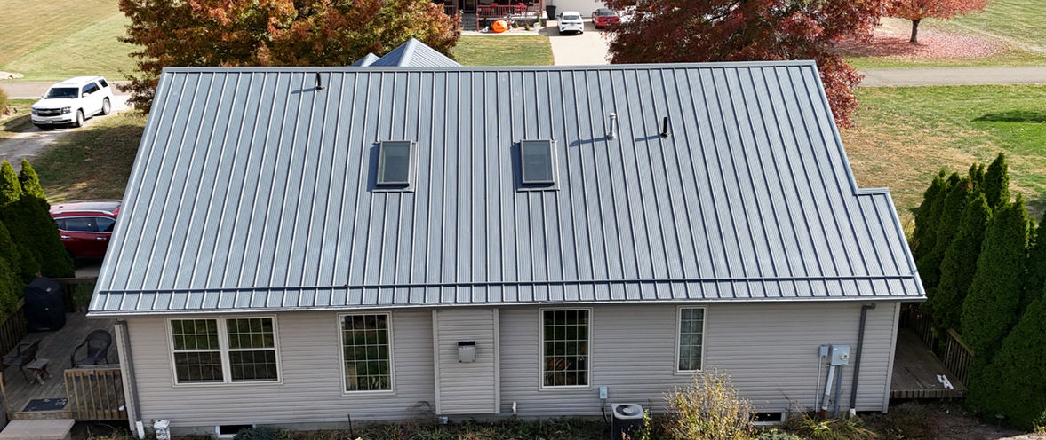 Strasburg, Ohio home featuring a Textured Sea Slate Legacy Rib metal roof installed by local roofing contractor Pine Ridge Roofing LLC.