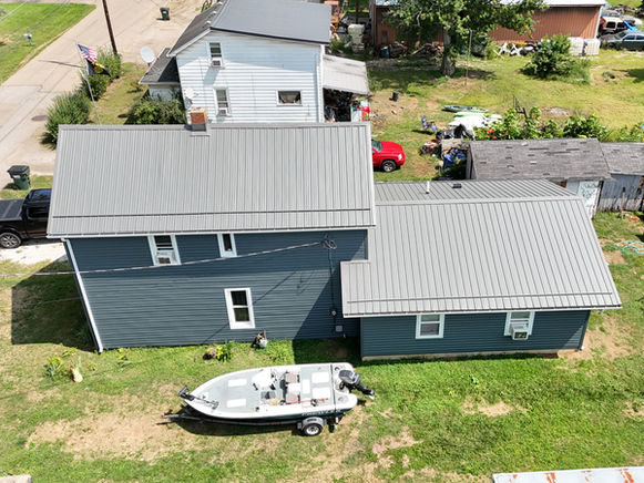 Dover, Ohio home featuring a Textured Charcoal Premier Rib metal roof installed by local roofing contractor Pine Ridge Roofing LLC.