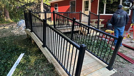 Wood deck with black railings