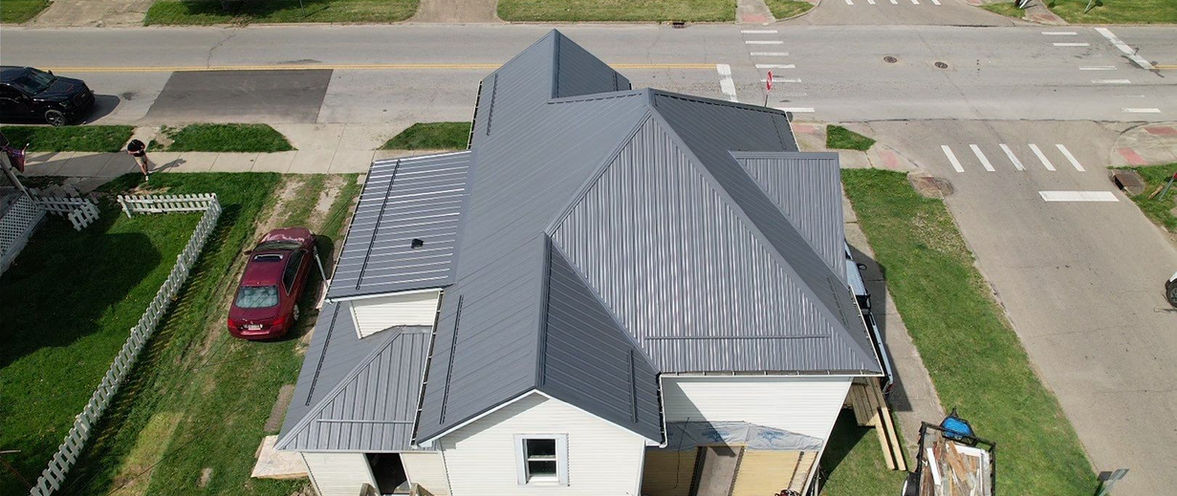 Dennison, Ohio home featuring a Charcoal Premier Rib metal roof installed by local roofing contractor Pine Ridge Roofing LLC.
