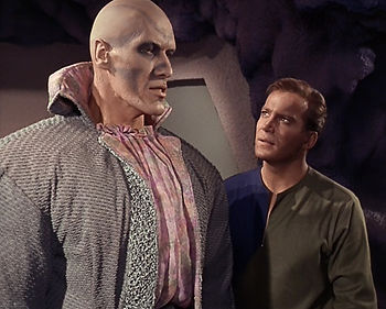 Kirk stares nervously at Ruk.