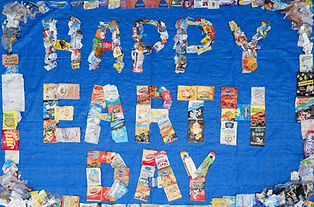trash art of the phrase happy earth day
